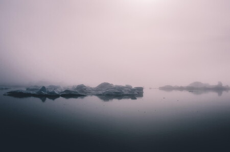 Warm light over Disko Bay in Greenland with icebergs