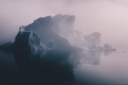 Icebergs in warm evening light in the Disko Bay of Greenland