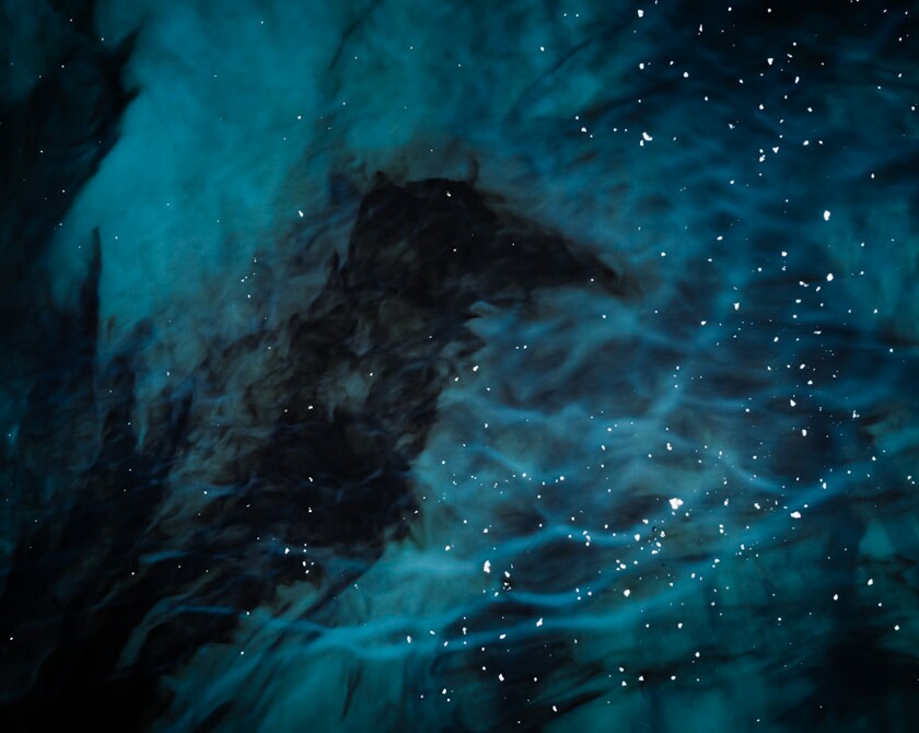 Aerial photography of dark glacier lagoon