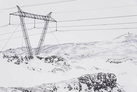 High voltage power line, lava rocks and snow in Iceland