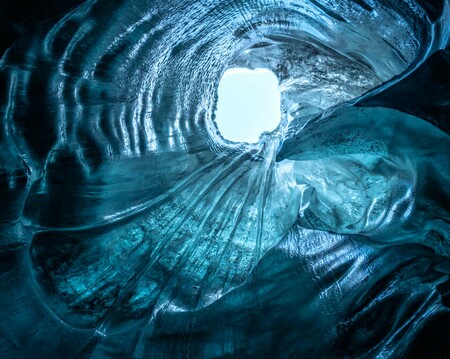 A hole in the ceiling of a glacier ice cave in Iceland