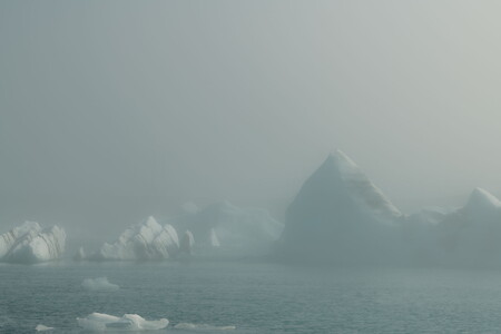 Icebergs in Jökulsárlón glacier lagoon in Iceland surrounded by dense fog in summer