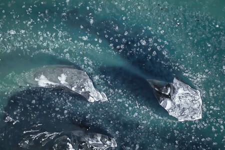 Aerial view of glacier river in Iceland in winter with small ice floes