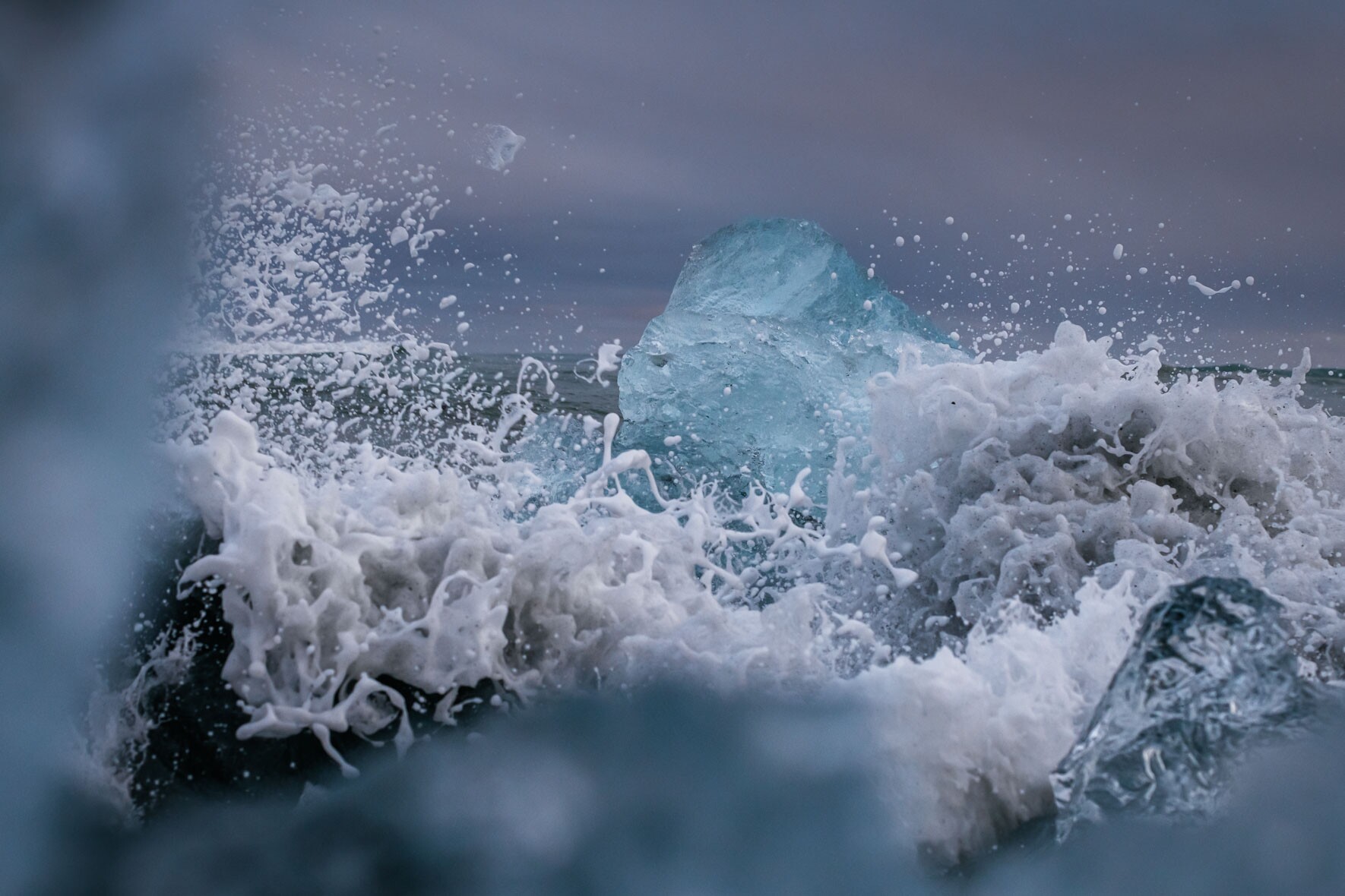 Waves Crashing at Icebergs on Diamond Beach near Jökulsárlón Glacier Lagoon