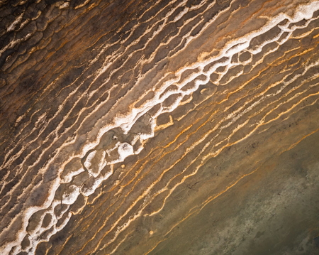 Colorful texture of frozen ponds on Jökuldalsheiði plateau in eastern Iceland