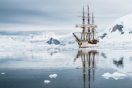 Bark Europa sailing along the coast of the Antarctic Peninsula