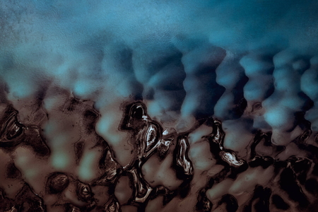 Abstract blue and brown aerial photography of a river in Norway