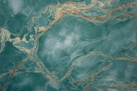 Abstract aerial view of a thawing lake with ice floes and flower pollen forming streaks on the water