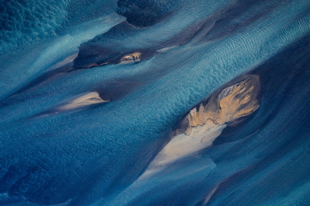 Aerial photography of Holsa river on the south coast of Iceland with small sandbanks