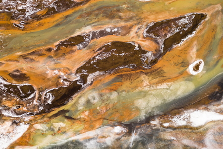 Aerial Winter Landscape of Iceland with Orange River, Black Sand and Ice