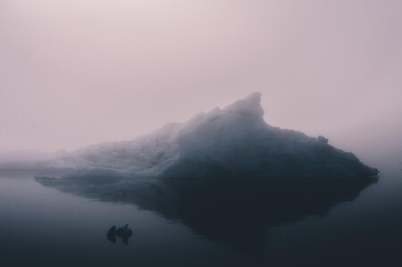 Foggy seascape with iceberg in warm light (Disko Bay, Greenland)