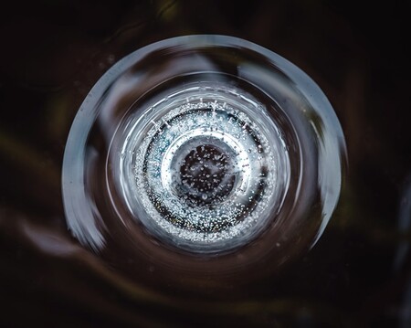 Abstract photograph of a frozen air bubble in a puddle