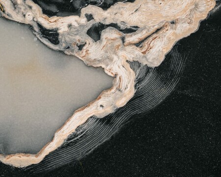 Abstract textures and patterns on the ice surface of a frozen lake in Norway