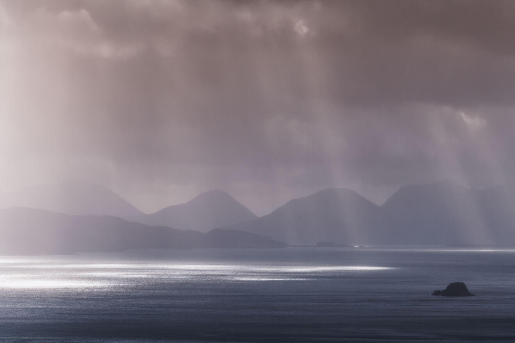 Sunbeams after rain shower over the Isle of Skye in Scotland