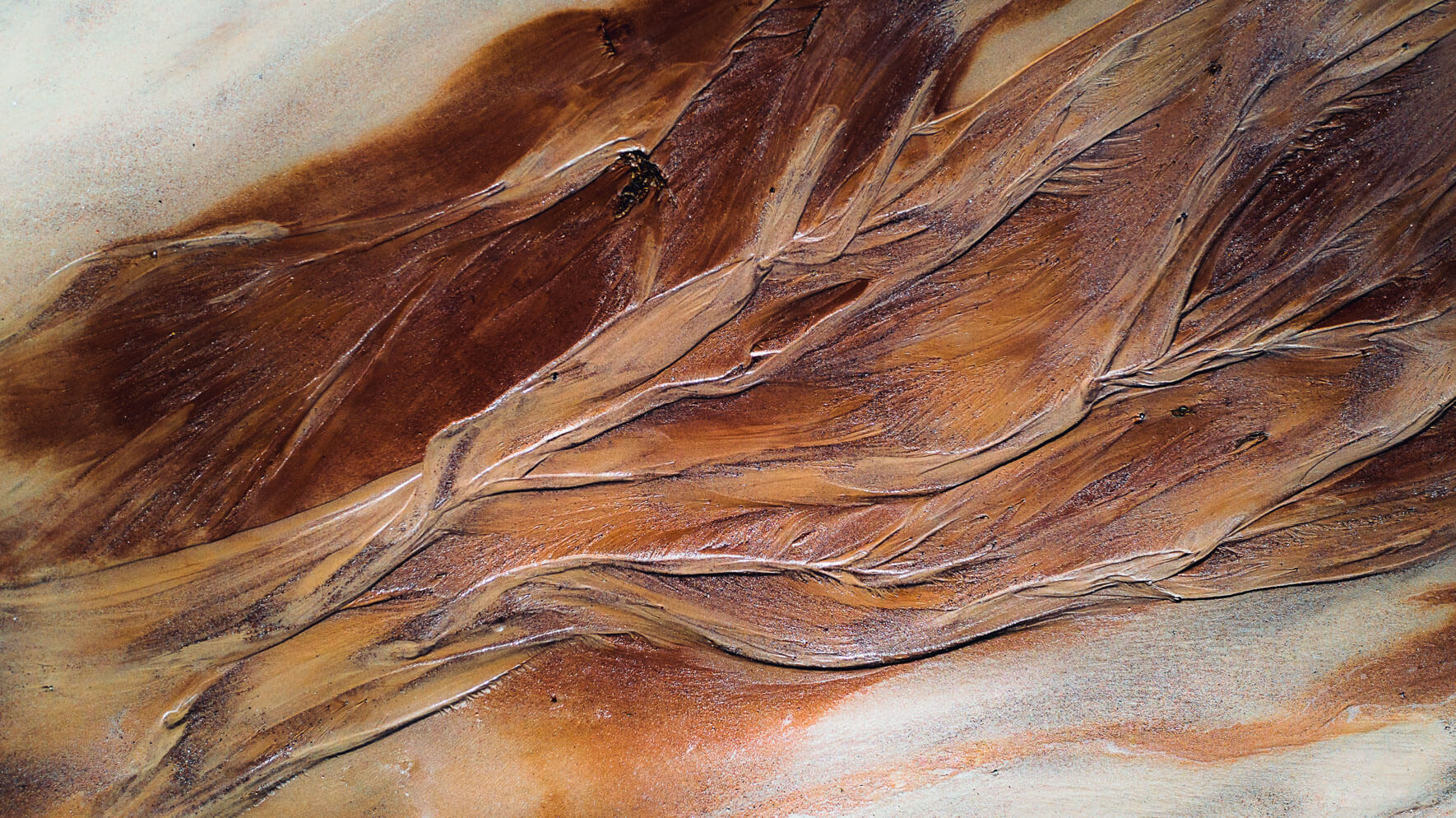 Aerial photography of abstract river on colored sediments