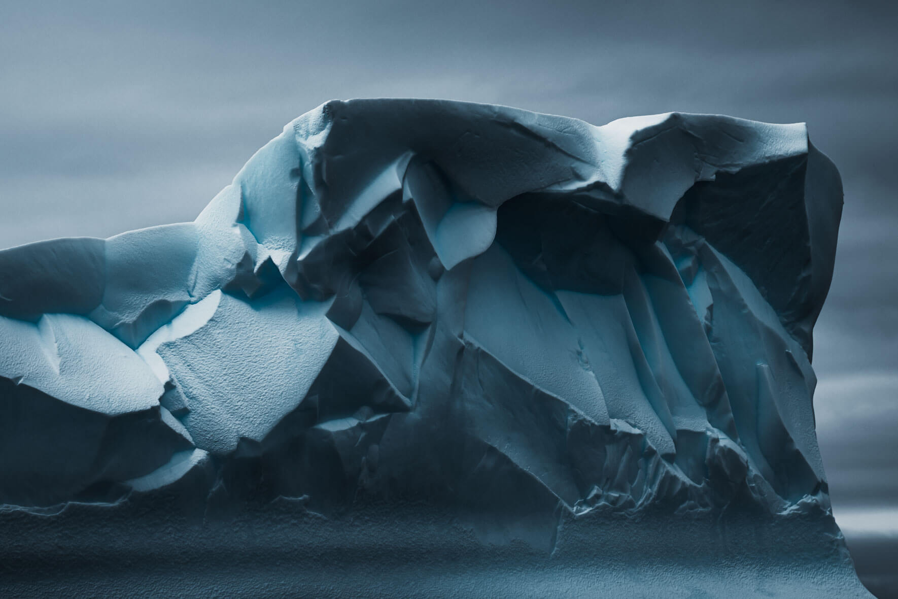 Abstract iceberg texture in Antarctica in dark colors