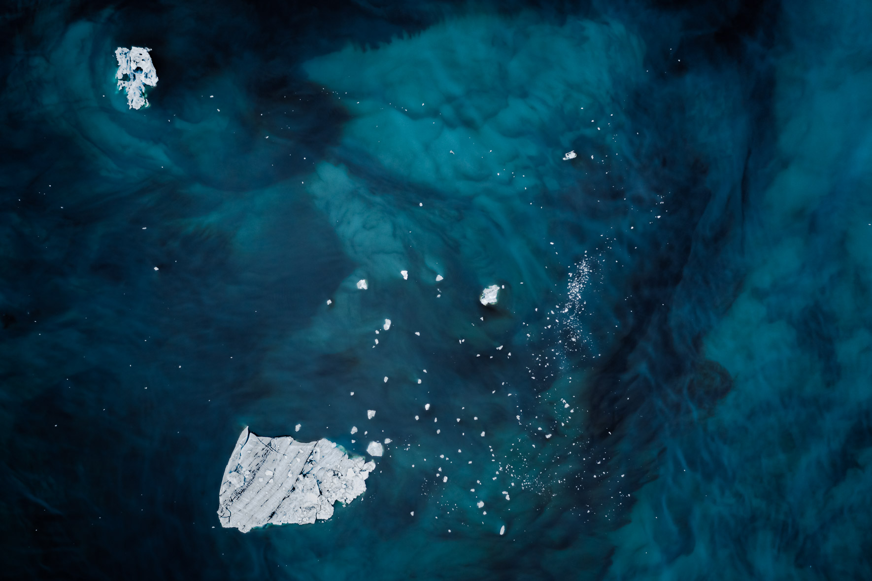 Aerial photography of icebergs floating in a glacier lagoon