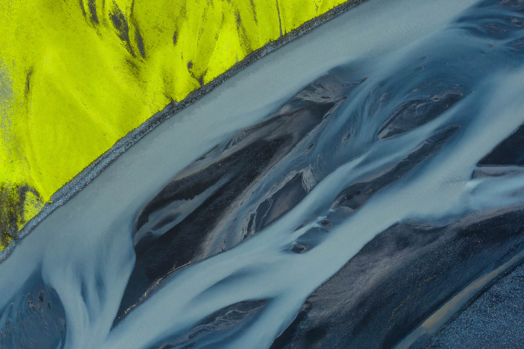 Aerial Photography of Neon Green Moss and River in Iceland