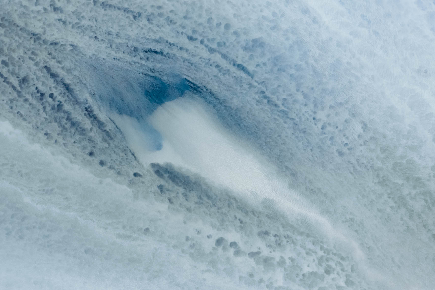 Abstract Aerial Photography of Milky Glacial River