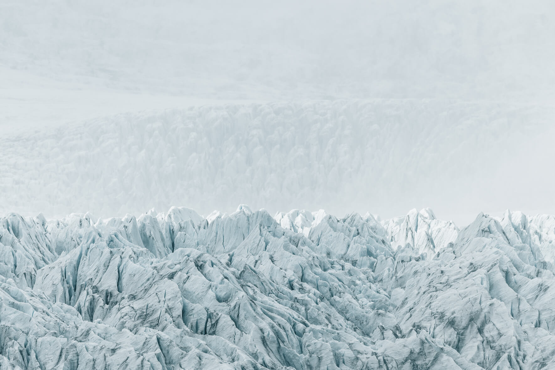 Fjallsárlón glacier in Iceland in bright sunlight with haze over ice