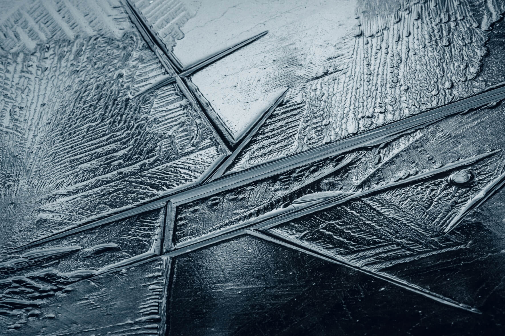 Abstract macro photography details in the ice surface of a frozen lake