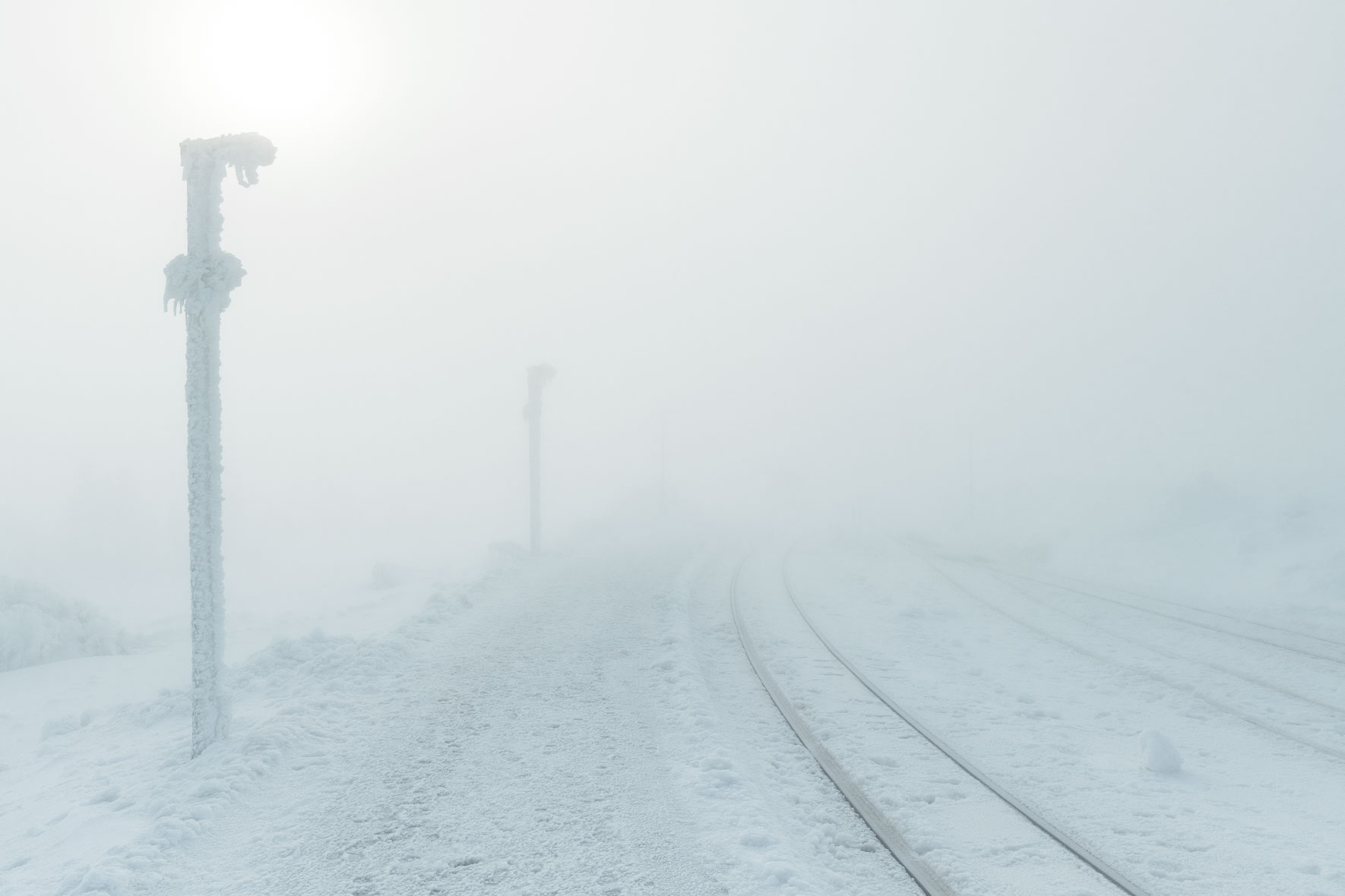 Snow and ice covered train tracks on top of Mount Brocken in the Harz Mountains