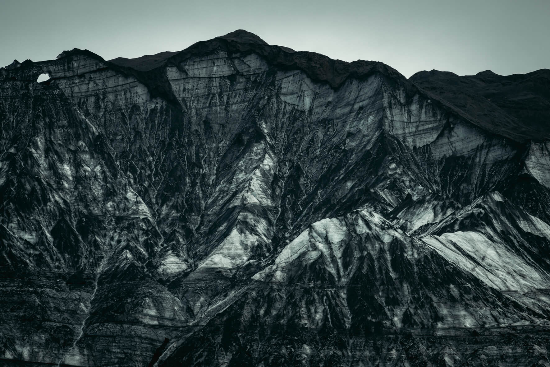 Glacial ice covered with sand and ash of Kötlujökull - an outlet glacier of Mýrdalsjökull in Iceland