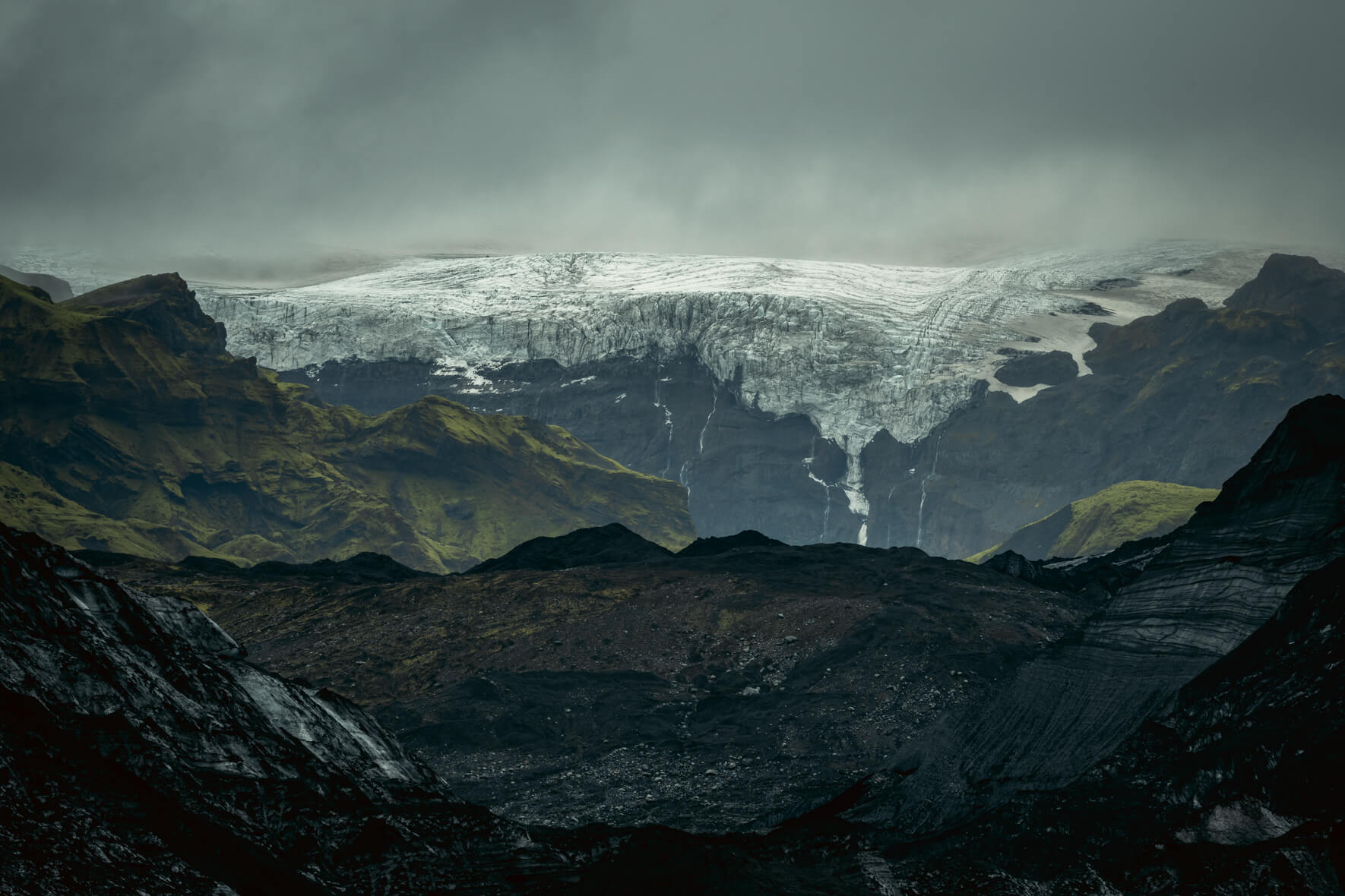 Dark glacier ice of Kötlujökull with Mýrdalsjökull in the background (Iceland)