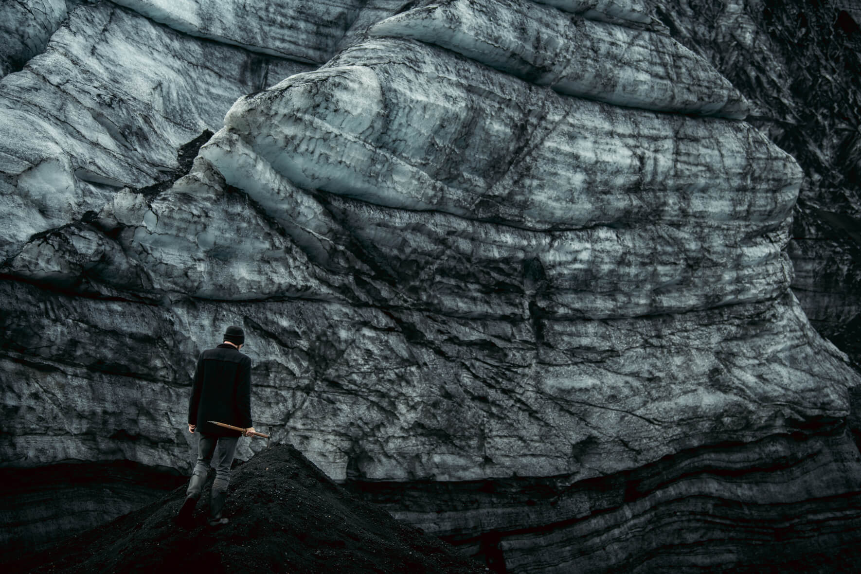 Textures of sand and ash covered ice of Kötlujökull glacier in Iceland