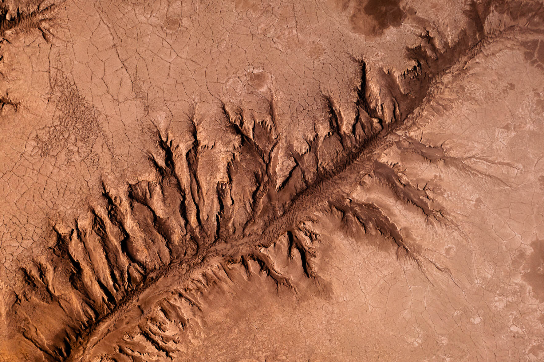 Aerial view of dried up river with cracked mud in highlands of Iceland