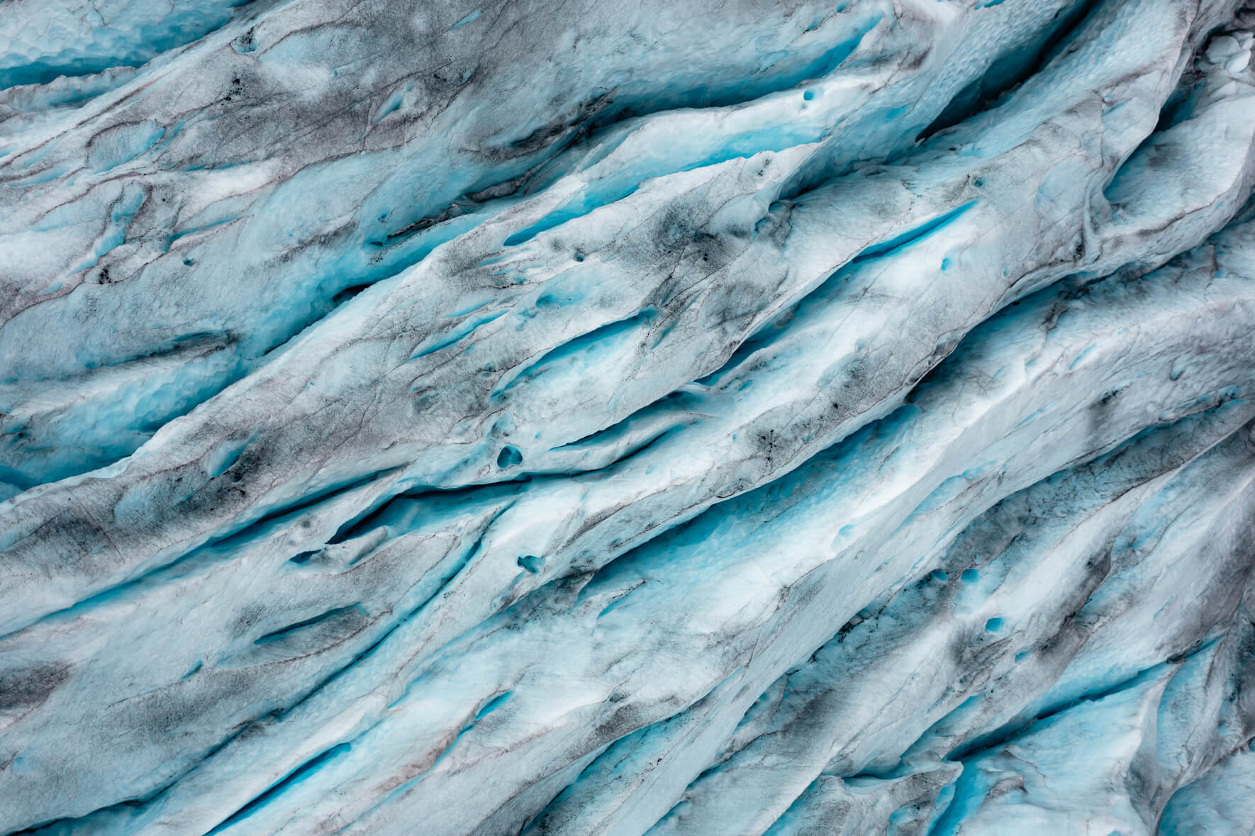 Aerial view of deep crevasses on a glacier in Norway