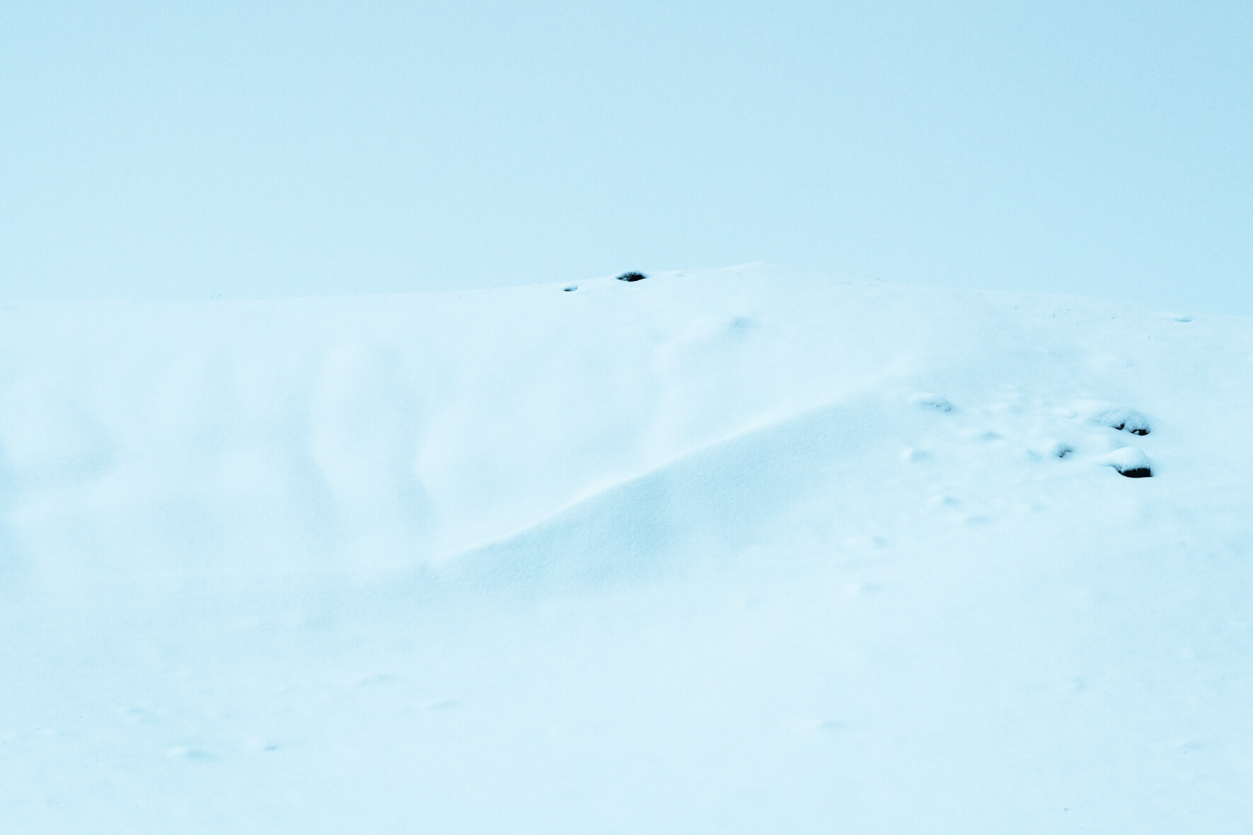 Snowy hills in minimalist winter landscape