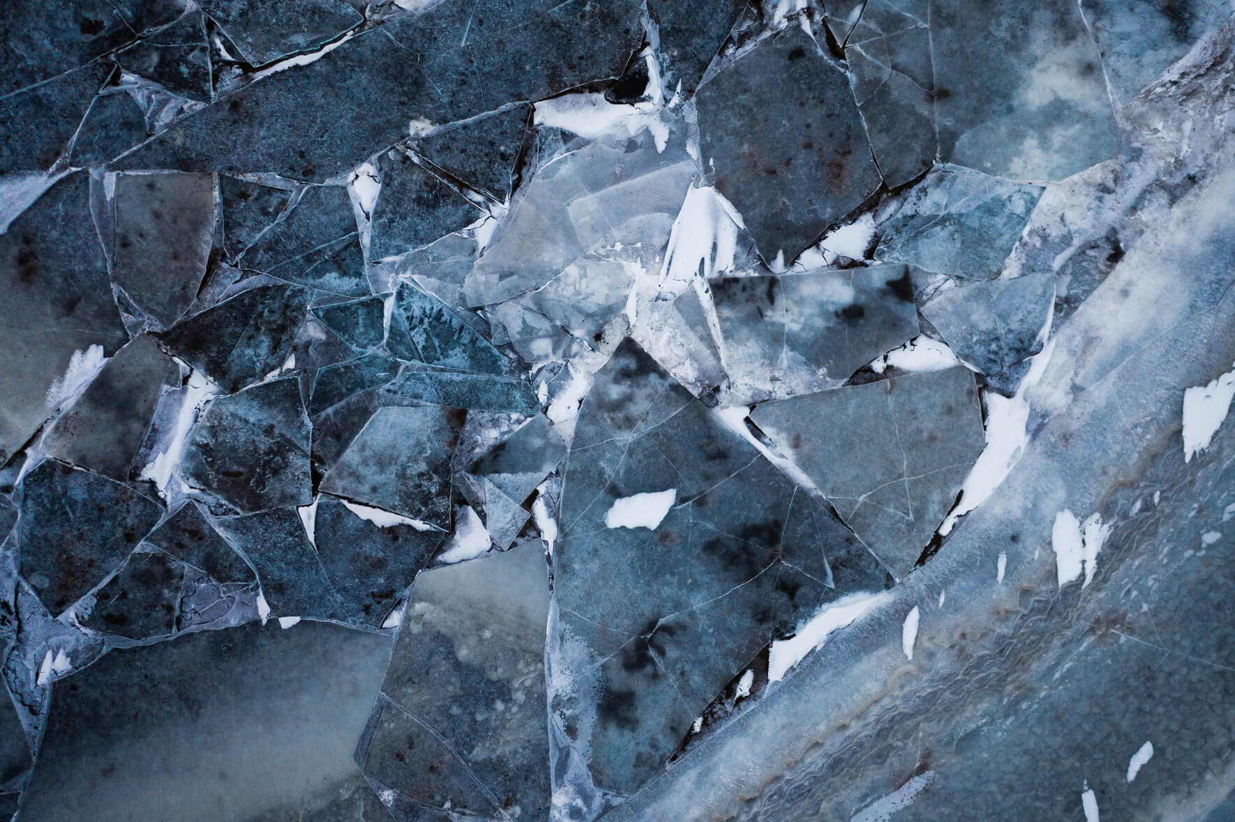 Abstract puzzle of ice floes on a frozen river in Iceland