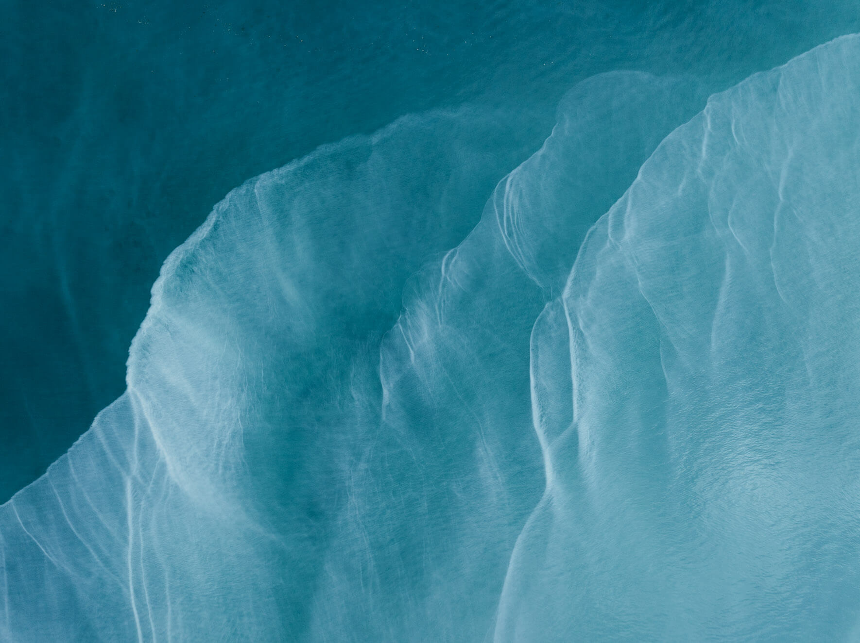 Aerial view of Kachemak Bay (Alaska) with vibrant turquoise and emerald waters