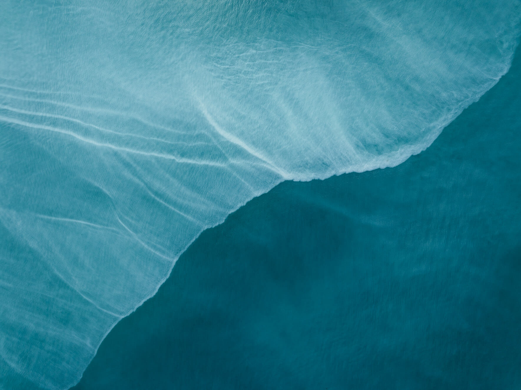 Turquoise waters in Kachemak Bay, Alaska, shaped by glacial silt and minerals