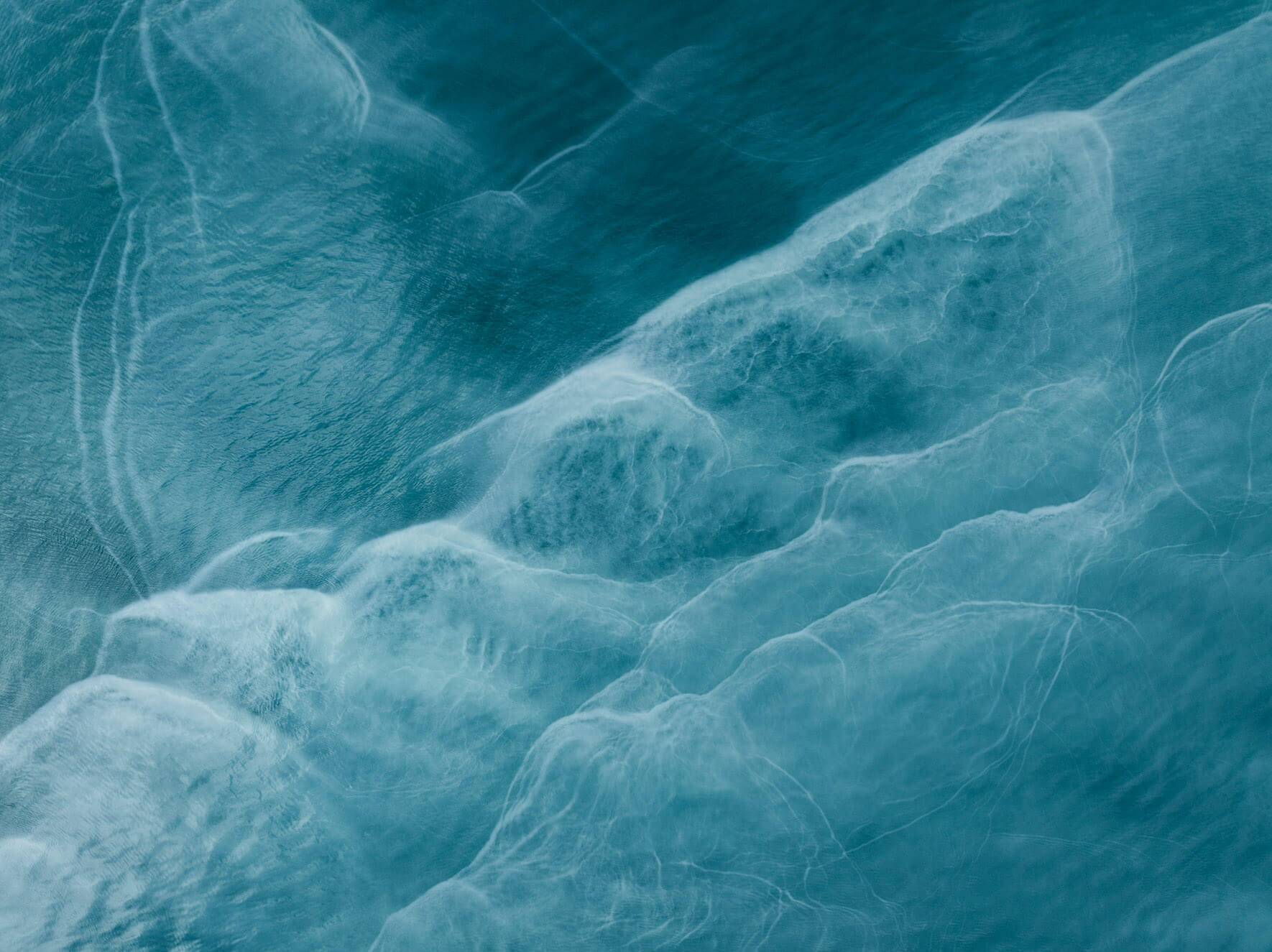 Aerial shot of Kachemak Bay (Alaska) highlighting its unique glacial water colors