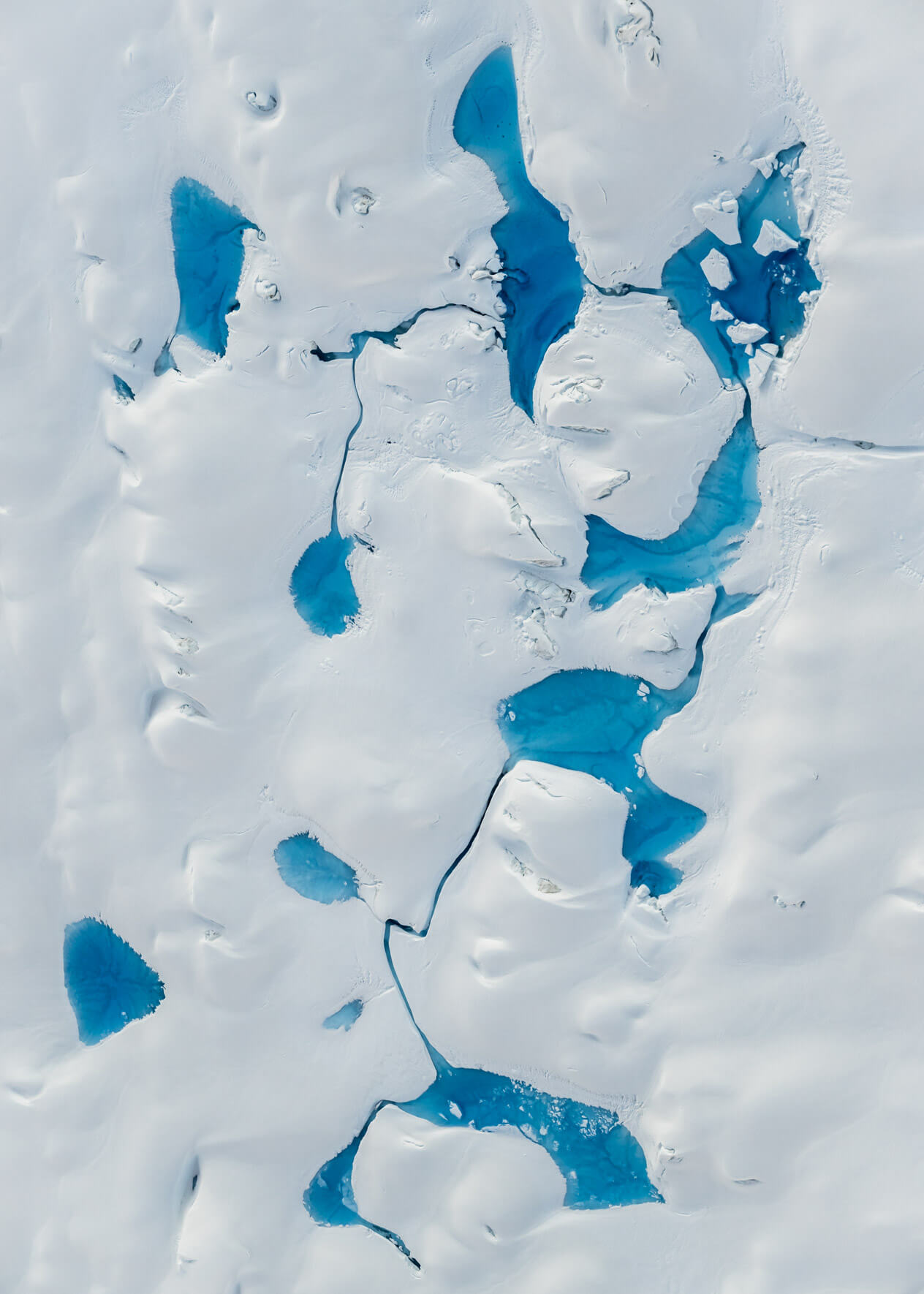 Aerial photograph of meltwater pools on Alaska’s rapidly retreating Columbia Glacier