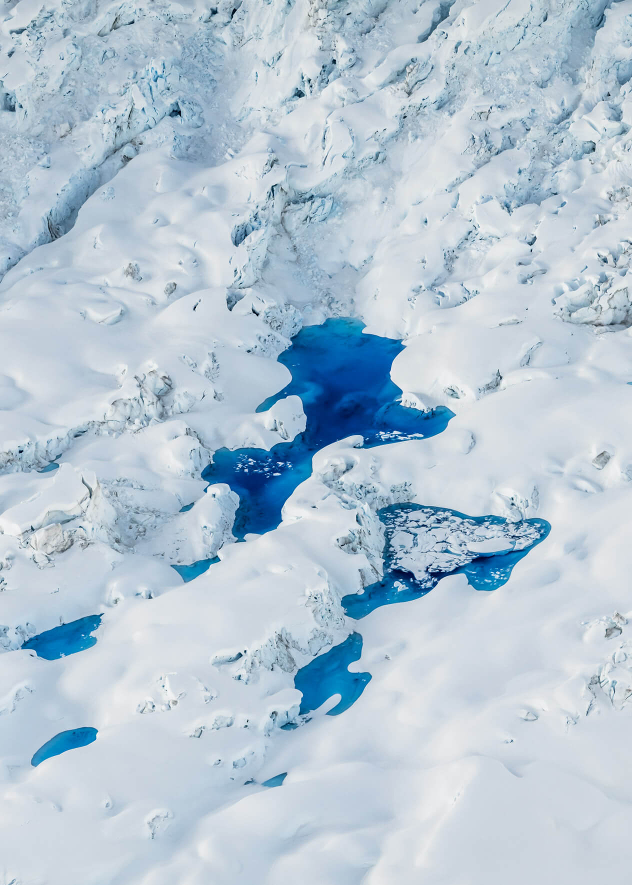 Aerial photograph of meltwater pools on Alaska’s rapidly retreating Columbia Glacier