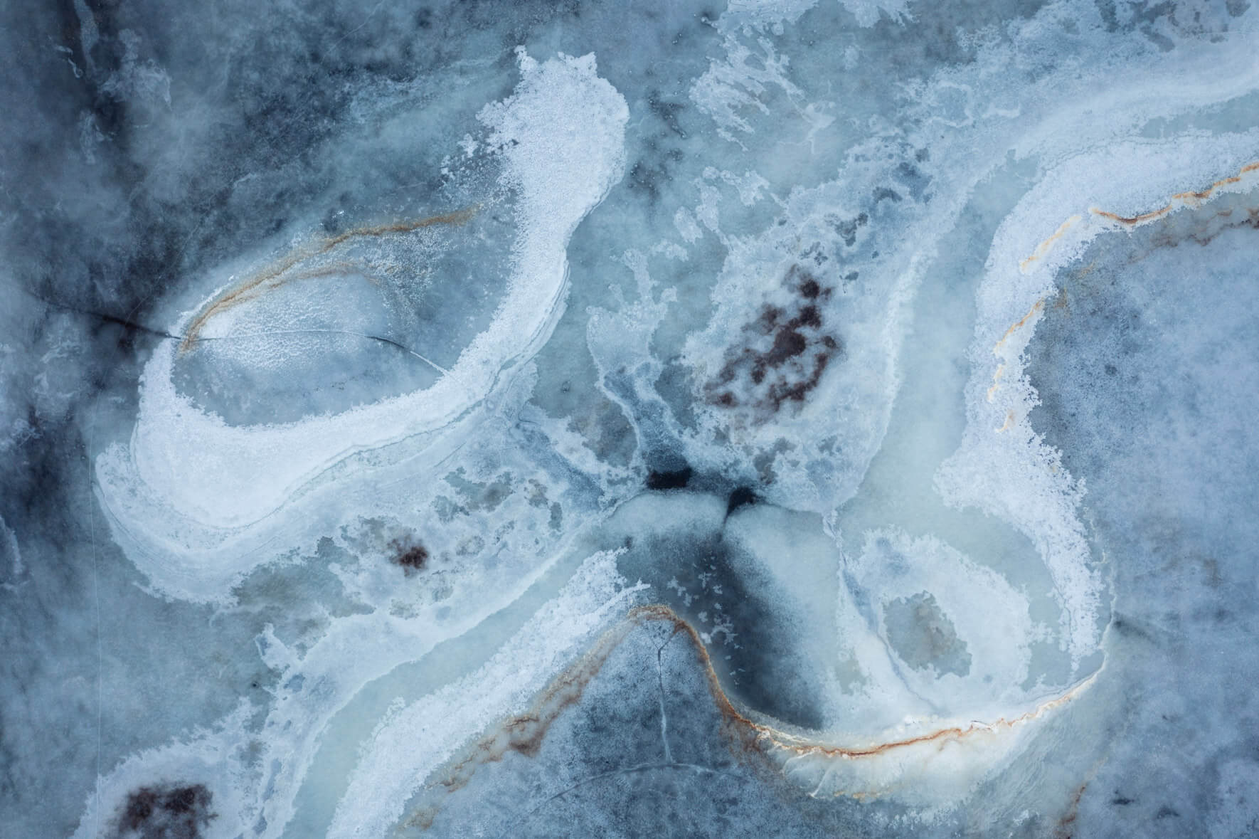 Aerial close-up of Iceland’s frozen wetlands