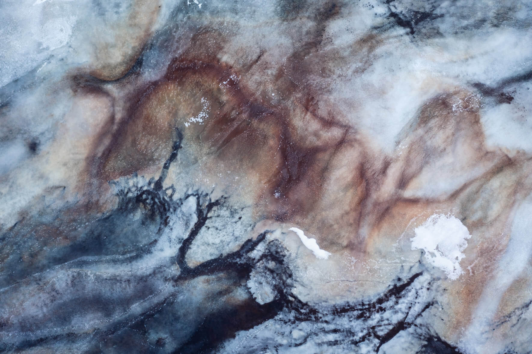 Frozen waterways and marsh textures in Iceland, captured with a drones