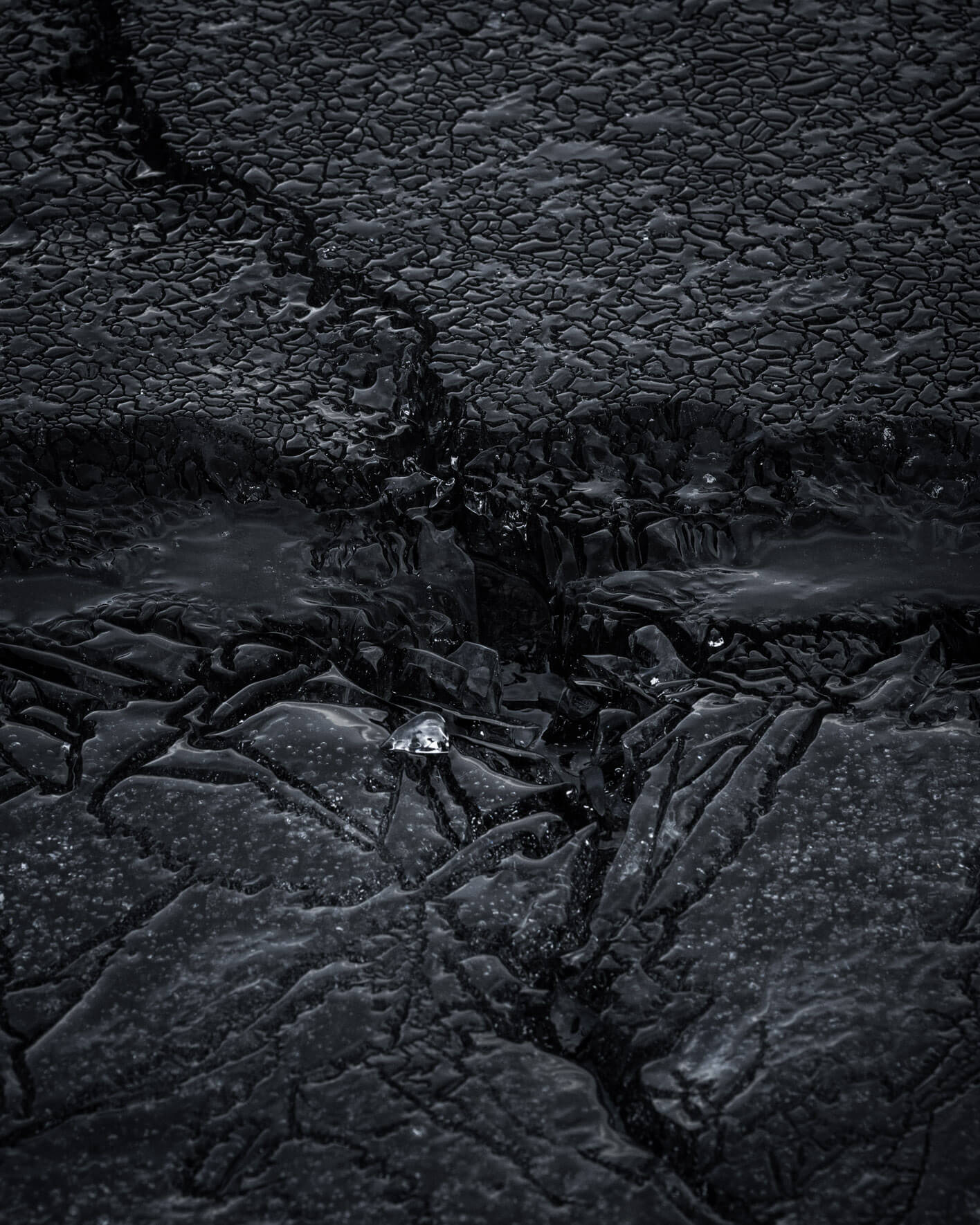 Abstract ice patterns on frozen surfaces at Lake Kleifarvatn, highlighting natural details in Iceland