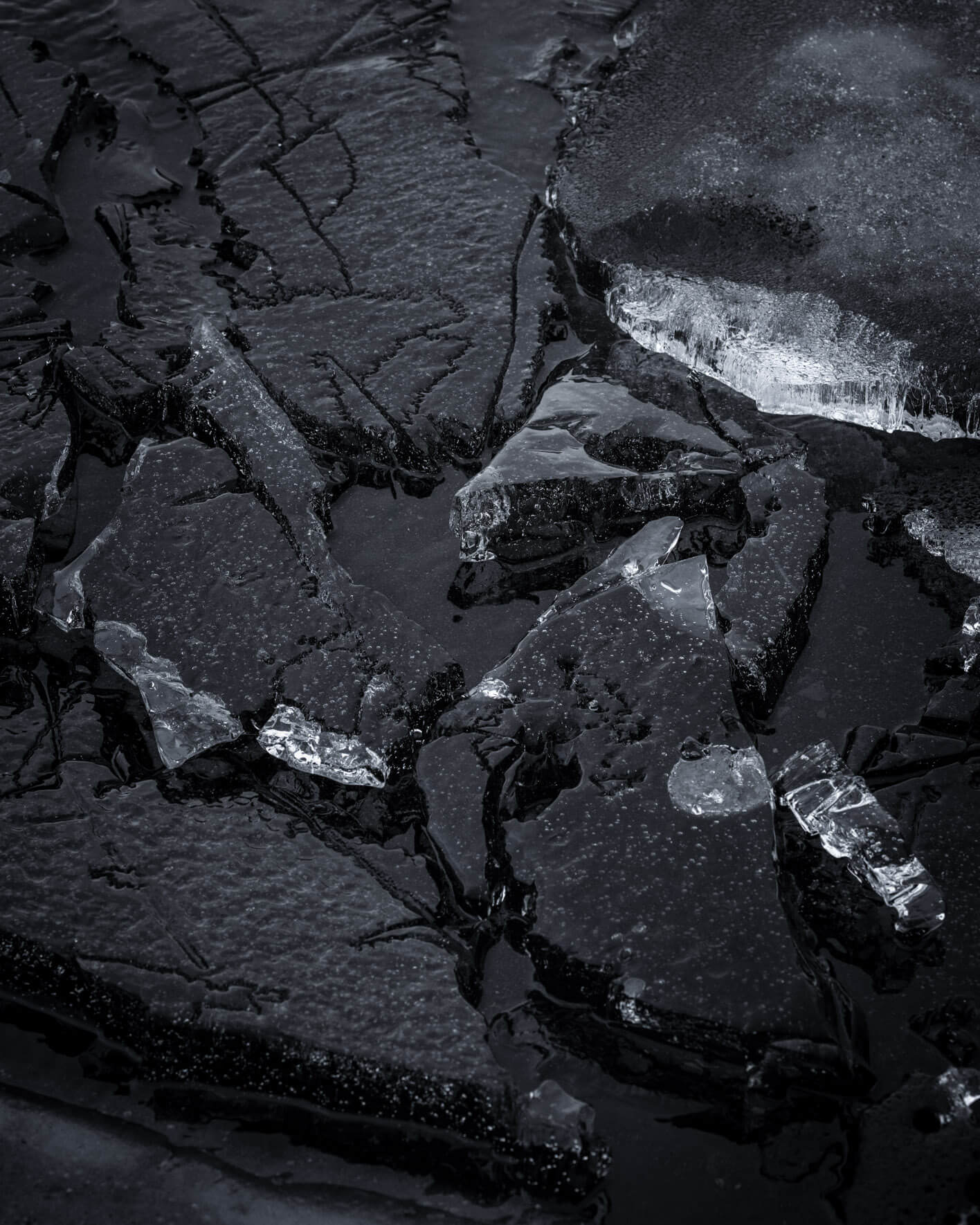 Abstract ice patterns on frozen surfaces at Lake Kleifarvatn in Iceland, highlighting natural details