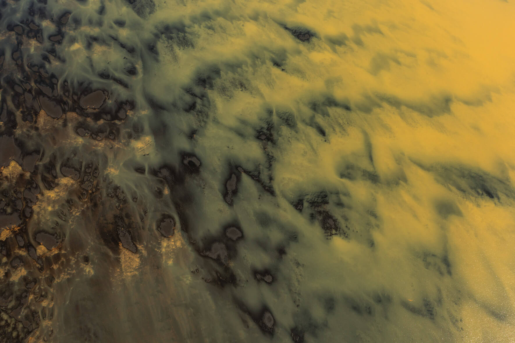 Drone capture of sulphur-rich waters carving through Iceland's volcanic landscape