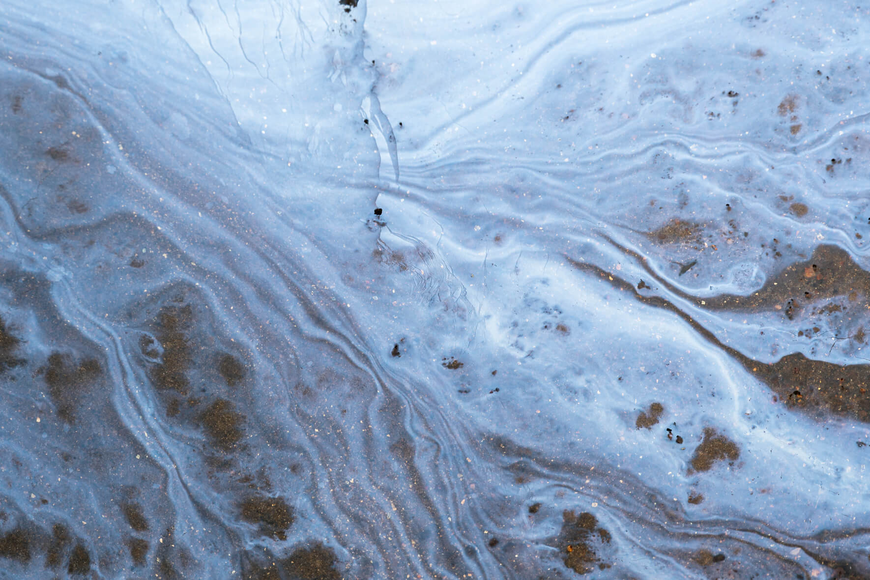 Close-up of iron-rich film with fractured crystalline structures