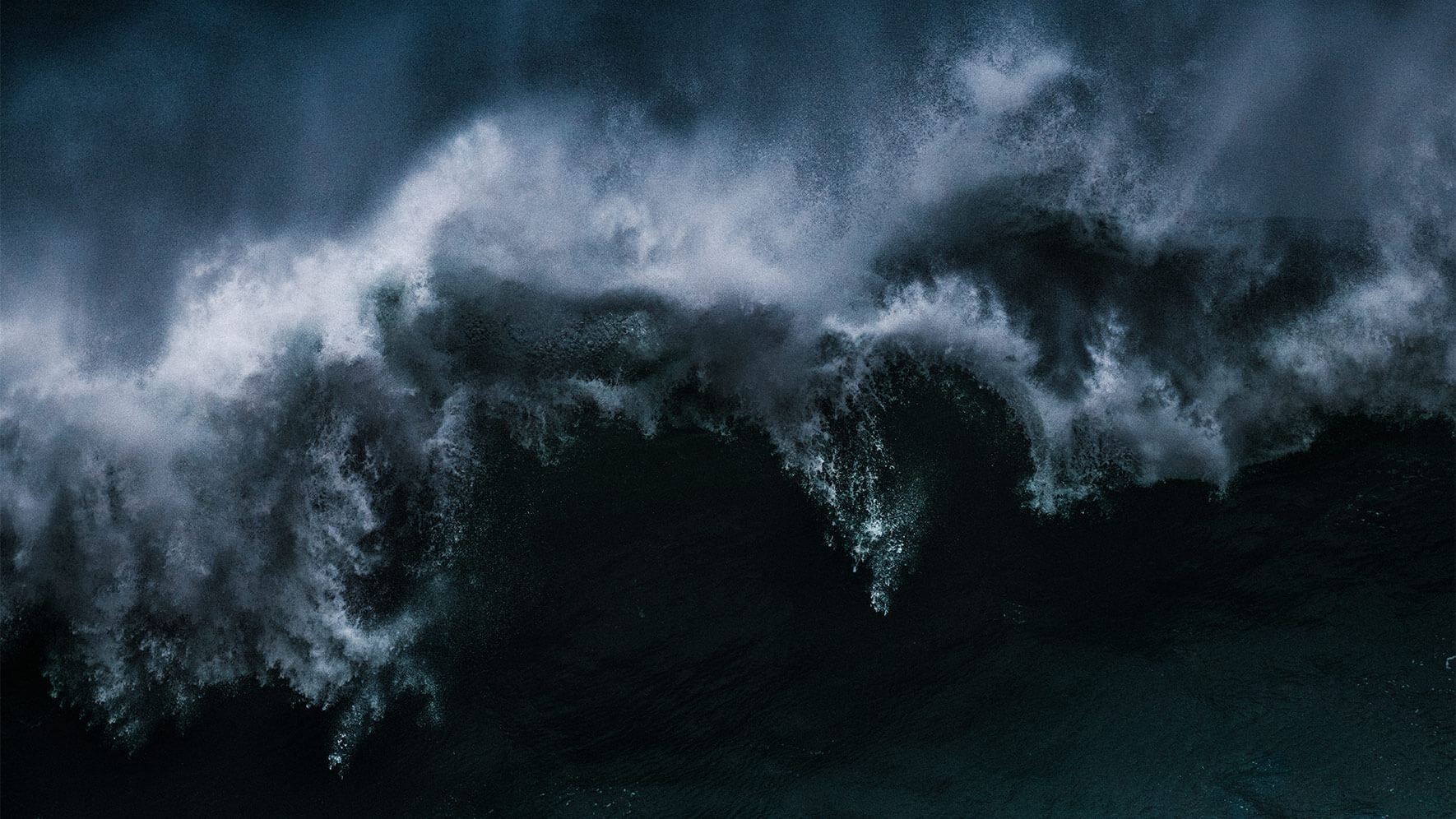 Crashing waves on Nazaré beach in Portugal