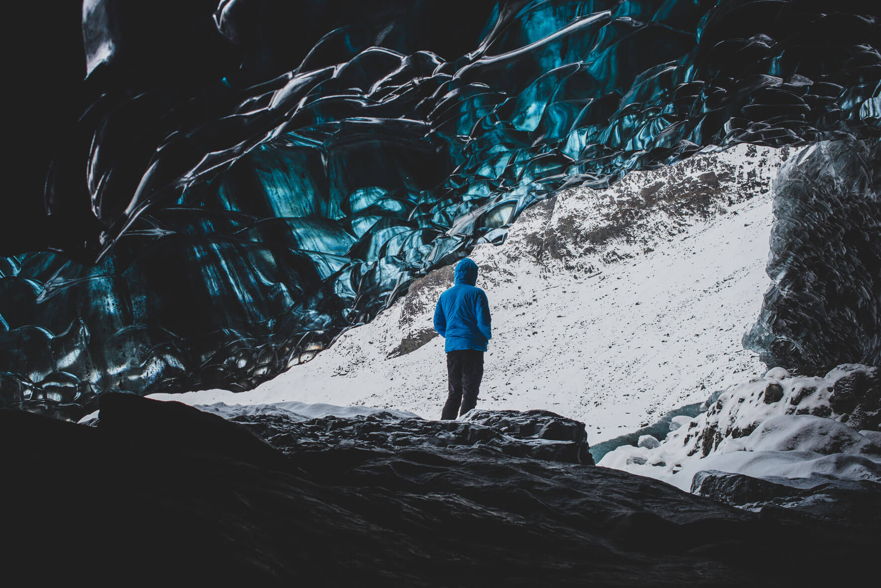 Winter fashion shooting in glacier cave in Iceland