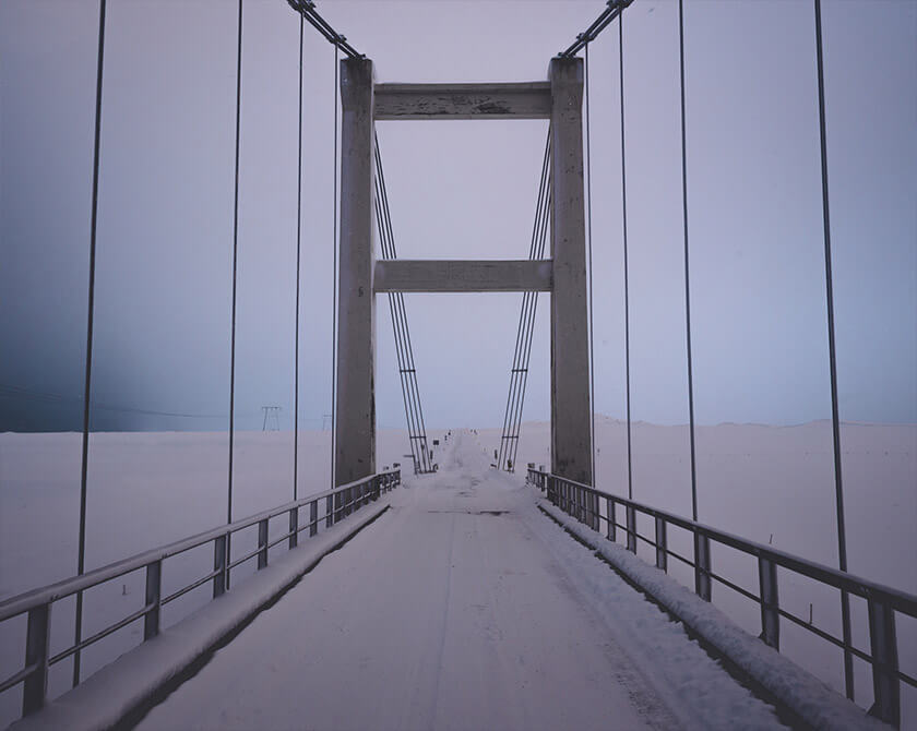 Snowy road and bridge in Iceland