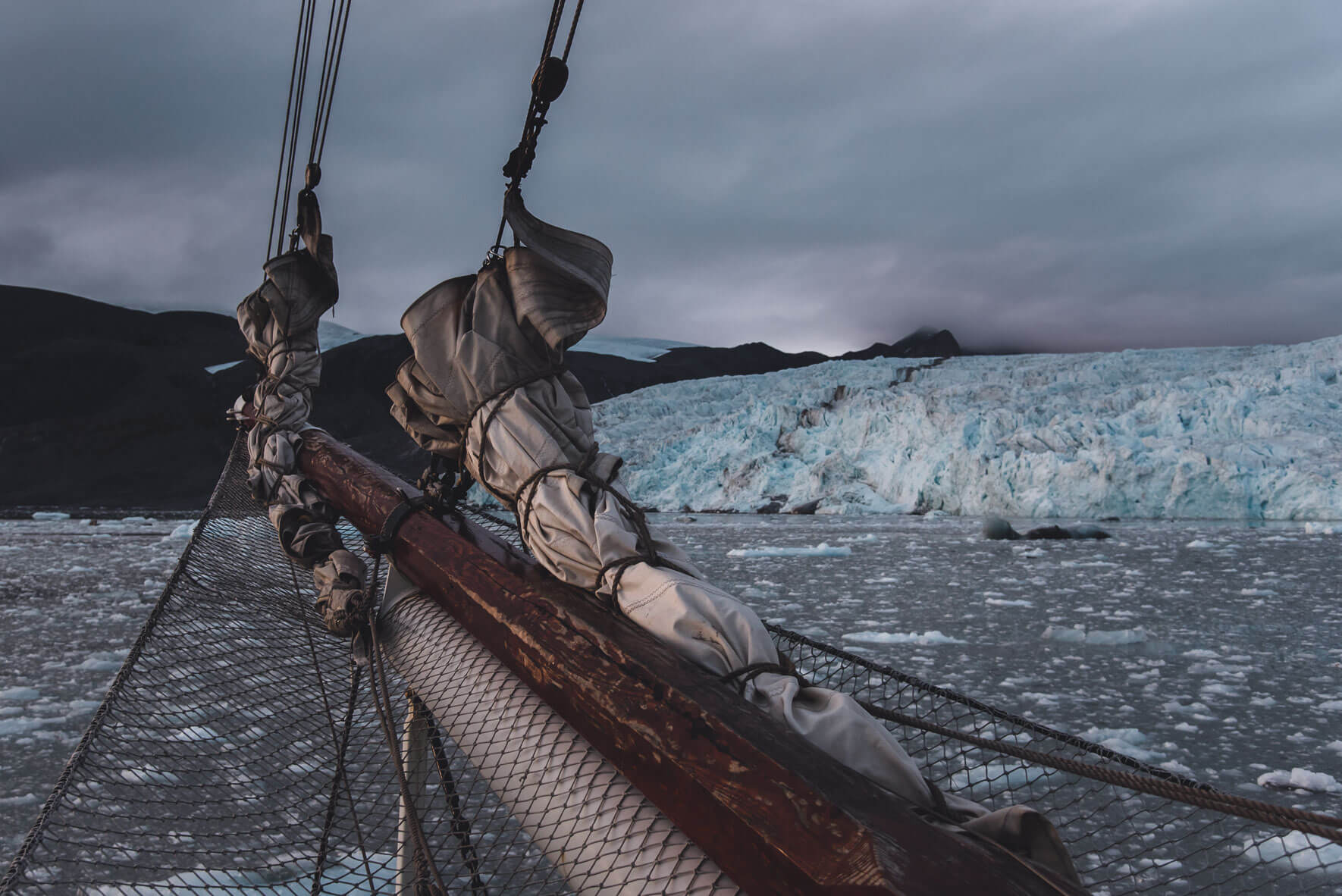 Sailing ship Antigua and glacier on Svalbard