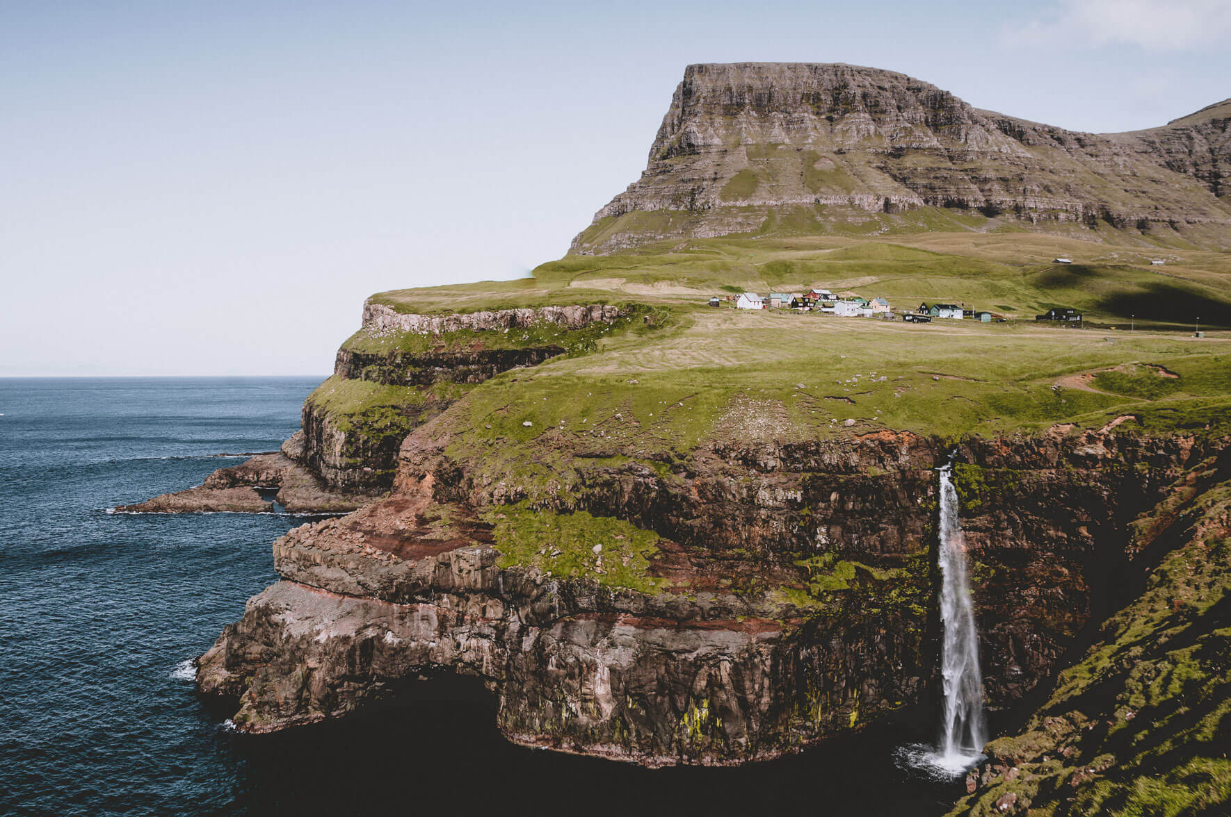 Múlafossur waterfall and the village Gásadalur on the Faroe Islands