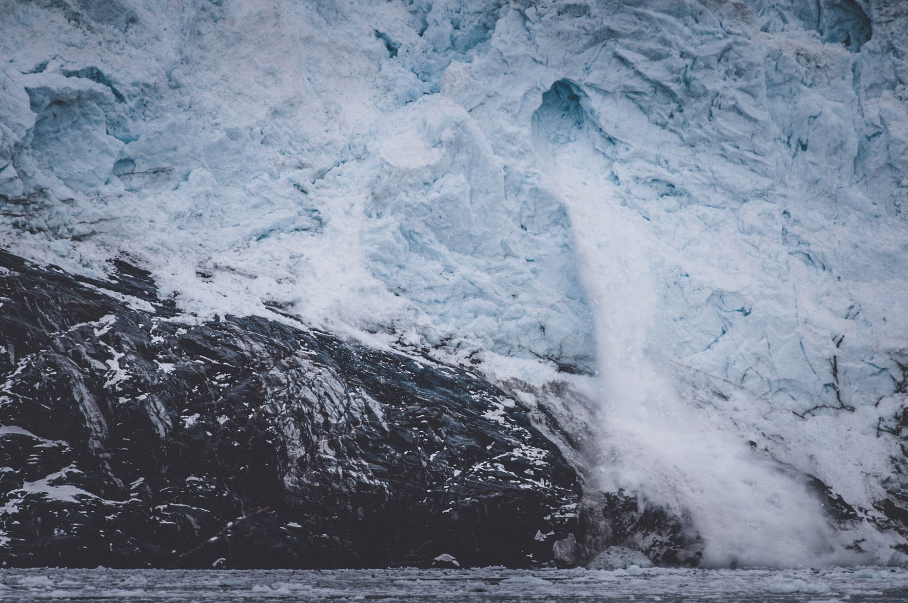 Ice calving of the Eqi Glacier in West Greenland